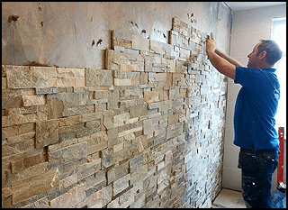Staff Member Installing Wall Tiles